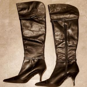 Knee-high or over-the-knee black leather dress boots